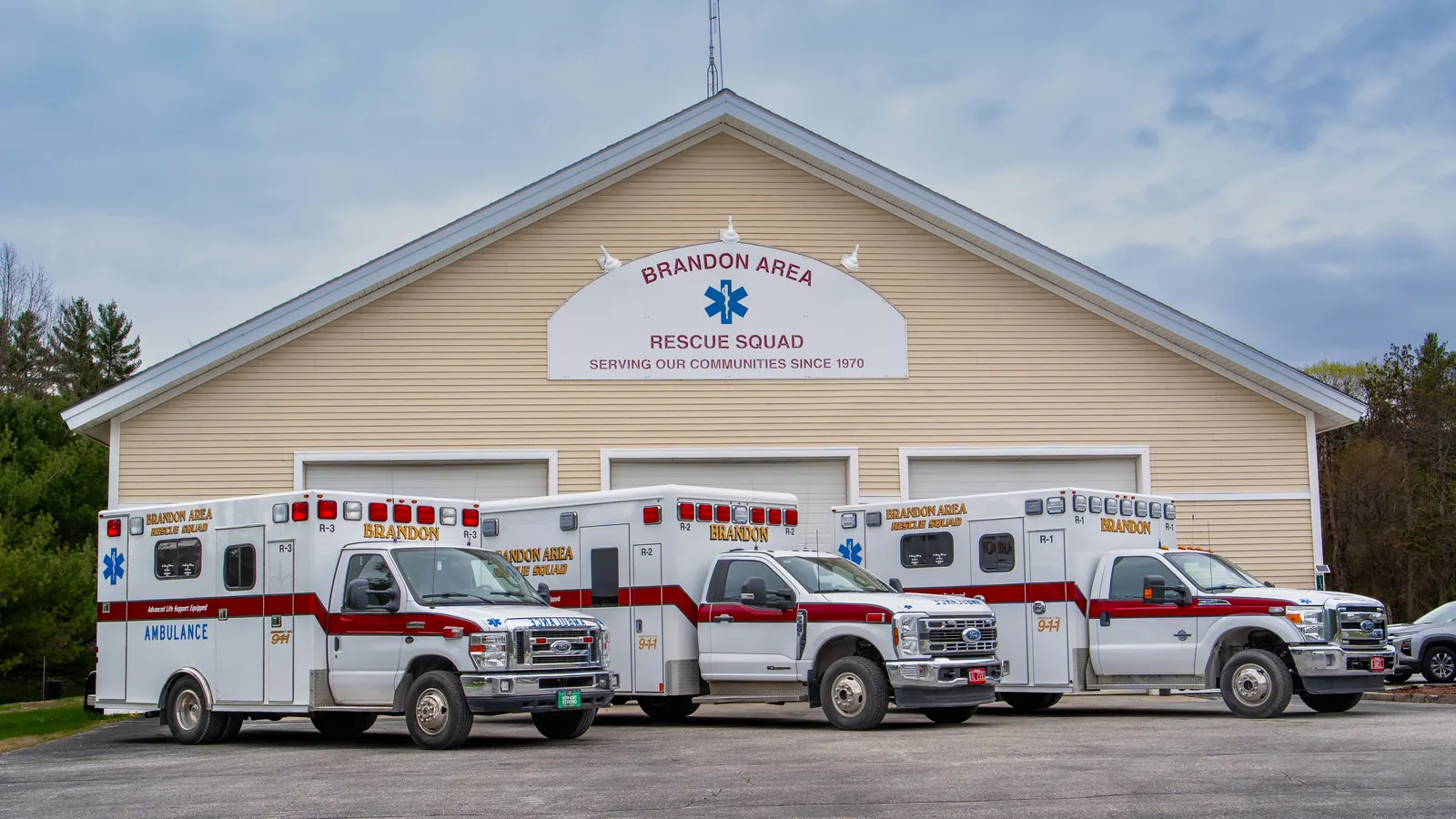 Three Brandon Area Rescue Squad ambulances parked outside the squad's station on Franklin Street in Brandon, Vermont.